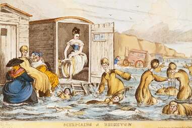 women sea-bathing with bathing machines in brighton, england